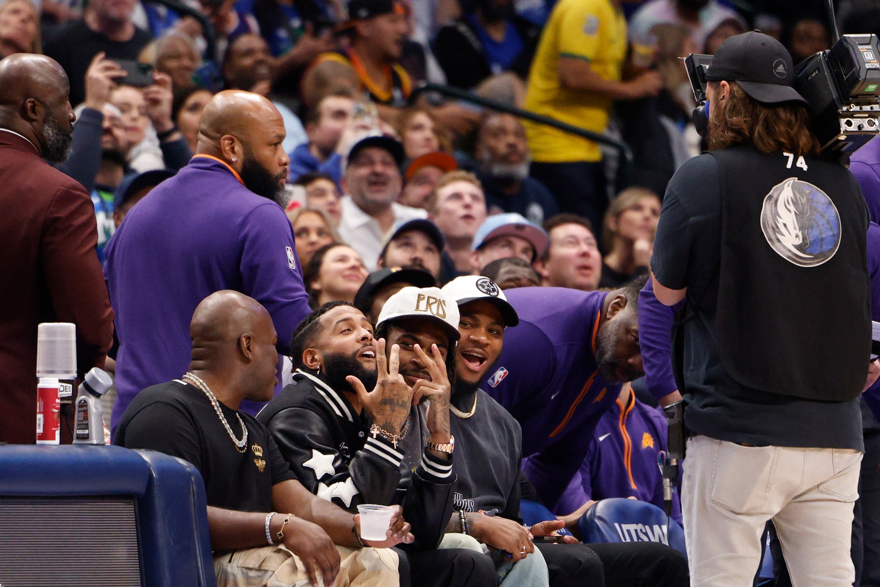 NFL free agent Odell Beckham Jr. poses for the camera as he’s shown on the Jumbotron during...