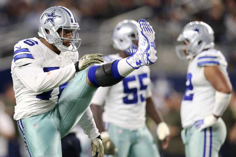 Dallas Cowboys defensive end Greg Hardy (76) stretches before the next play during the...