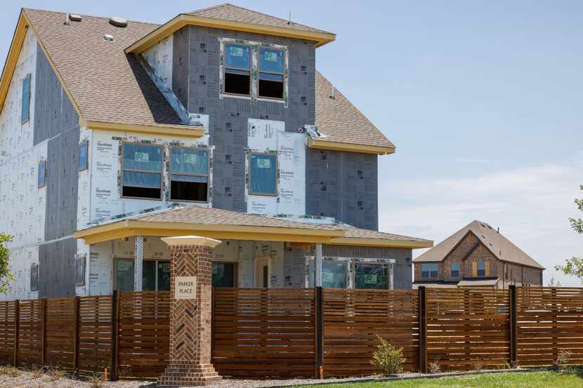 Homes in different phases of construction stand in the Parker Place neighborhood in...