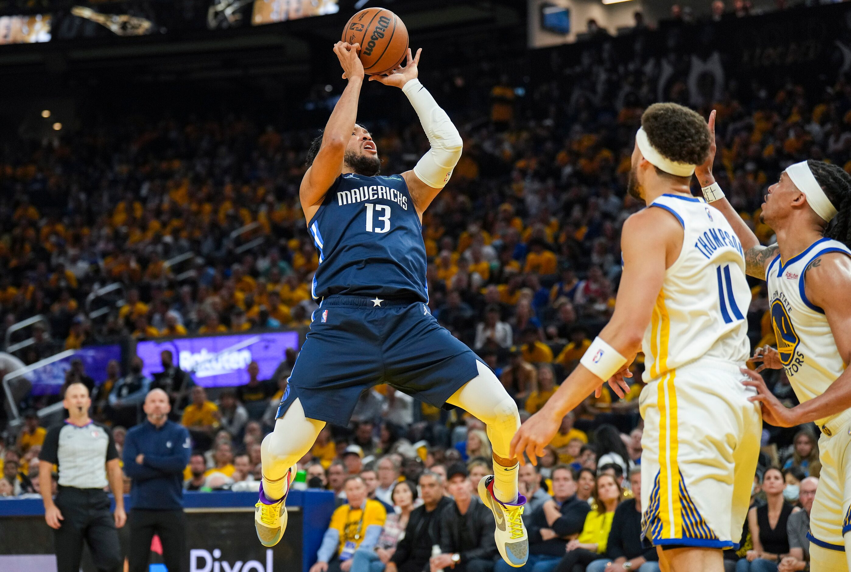 Dallas Mavericks guard Jalen Brunson (13) scores past Golden State Warriors guard Klay...