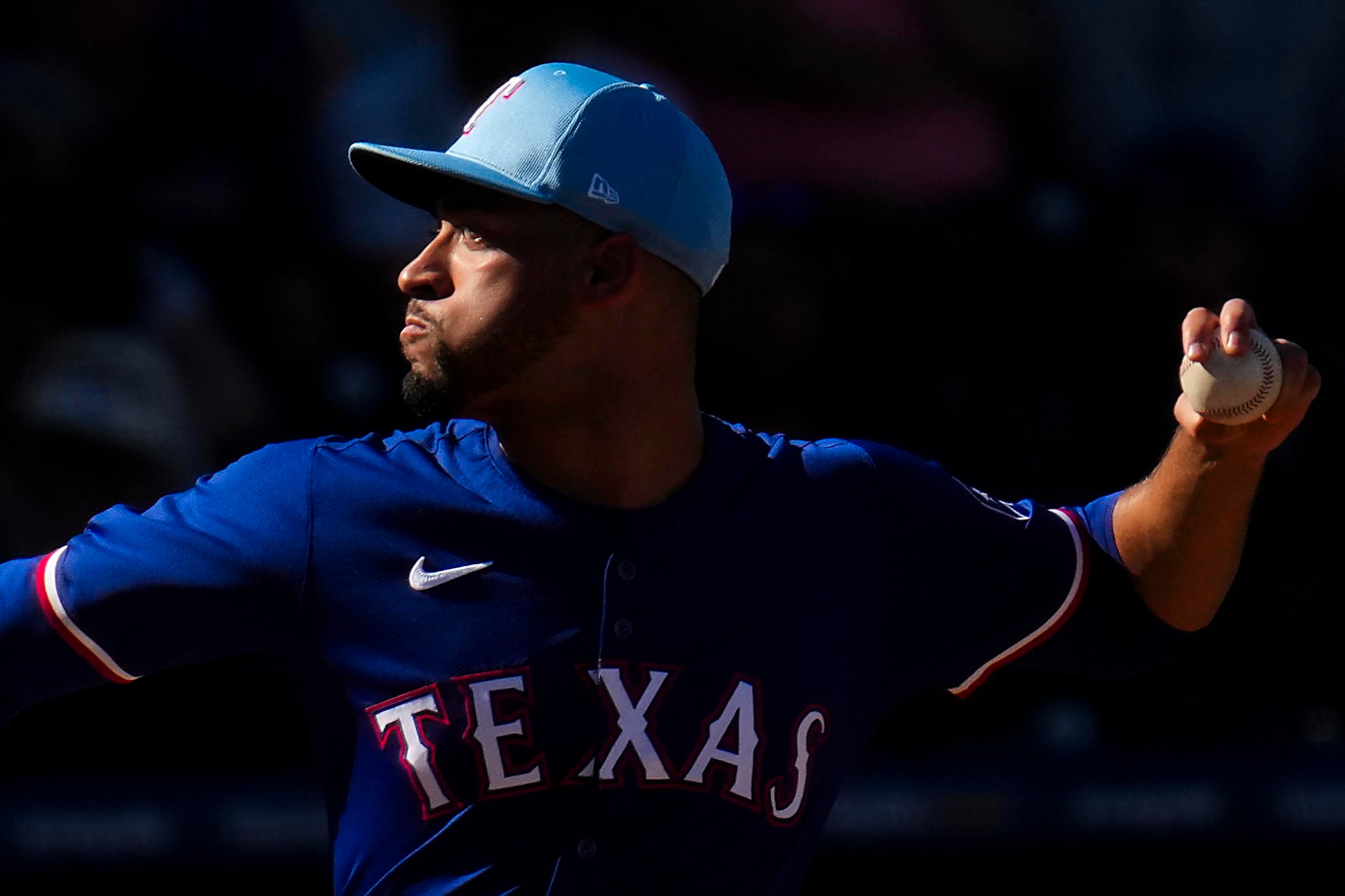 Texas Rangers pitcher Antoine Kelly delivers during the seventh inning of a spring training...