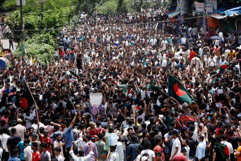 In Dhaka, Bangladesh, on Sunday, Aug. 4, 2024, people demonstrated against Prime Minister...
