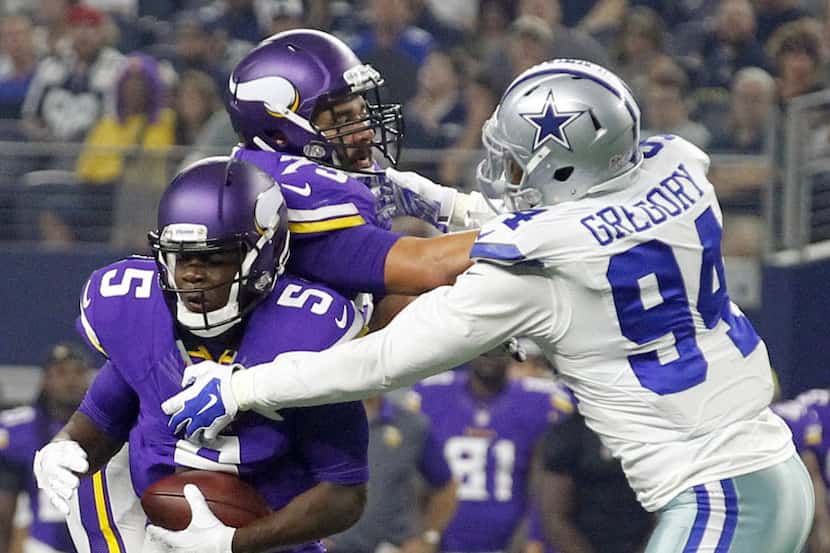 Minnesota Vikings quarterback Teddy Bridgewater (5) is sacked by Dallas Cowboys defensive...