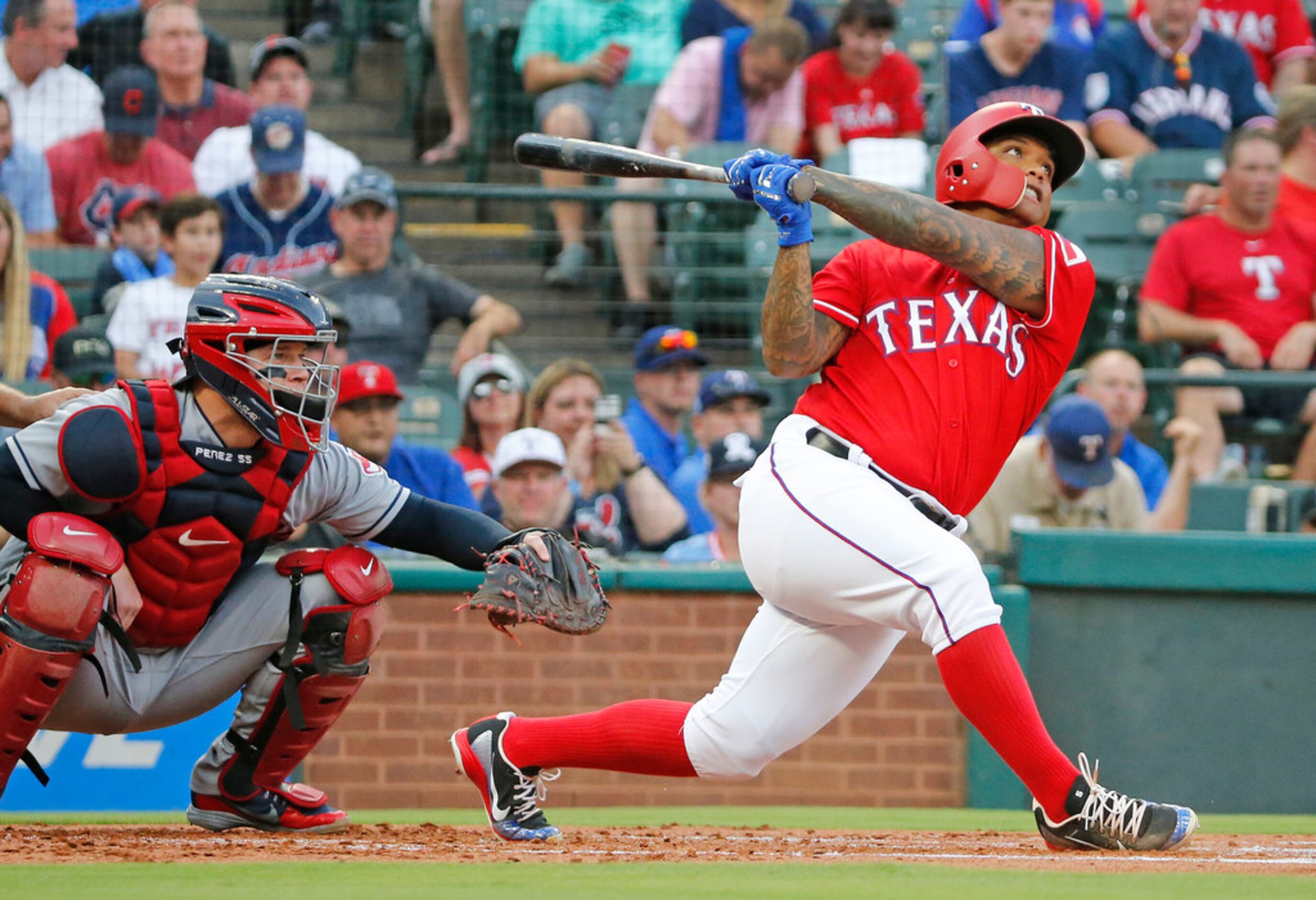 Texas Rangers designated hitter Willie Calhoun (5) flies out to right field in the first...