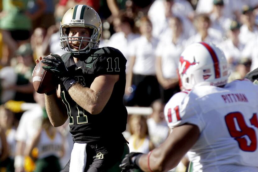 Baylor quarterback Nick Florence (11) looks to pass against Southern Methodist defensive...