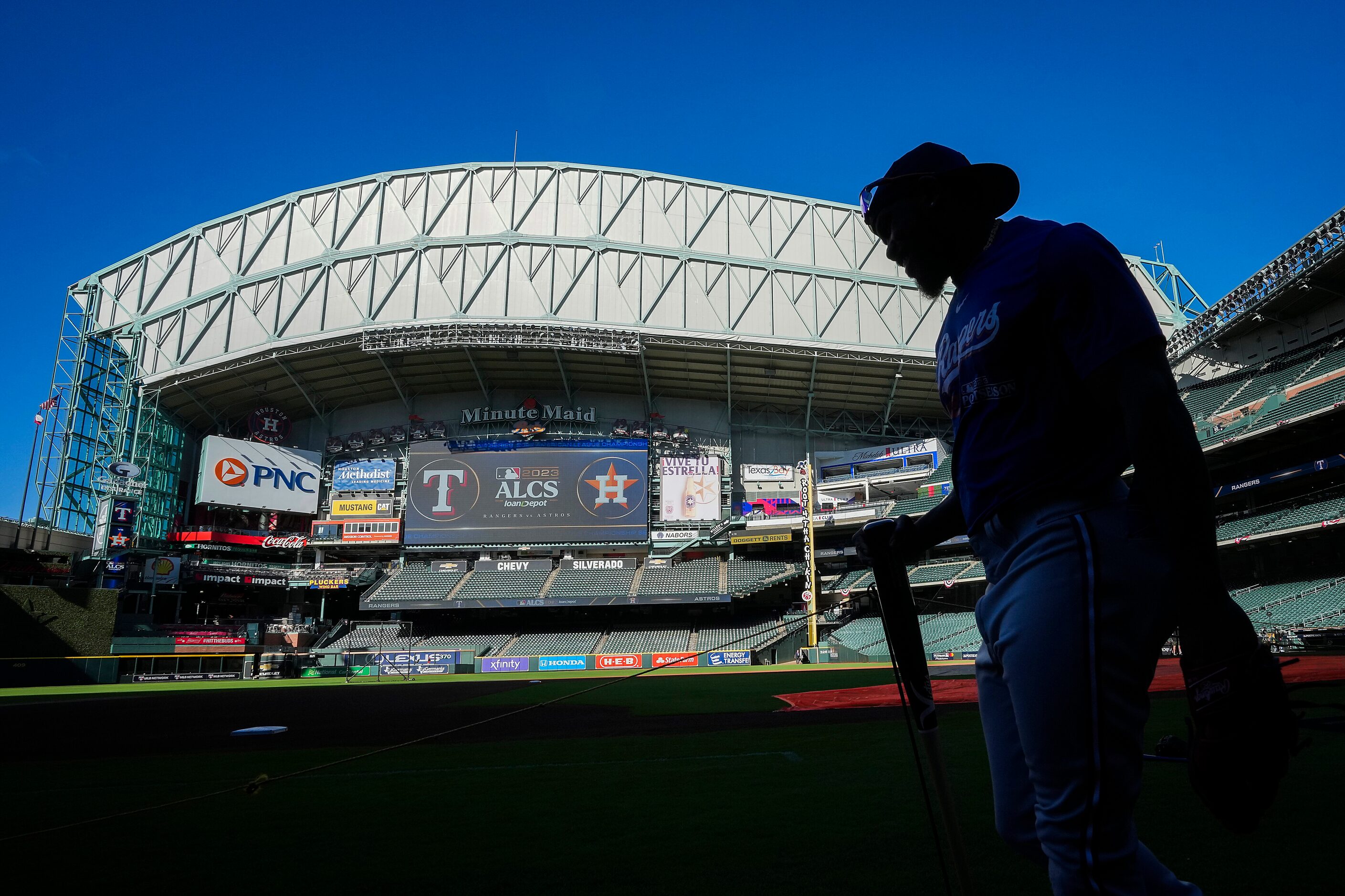 Texas Rangers right fielder Adolis Garcia takes the field for a workout in preparation for...