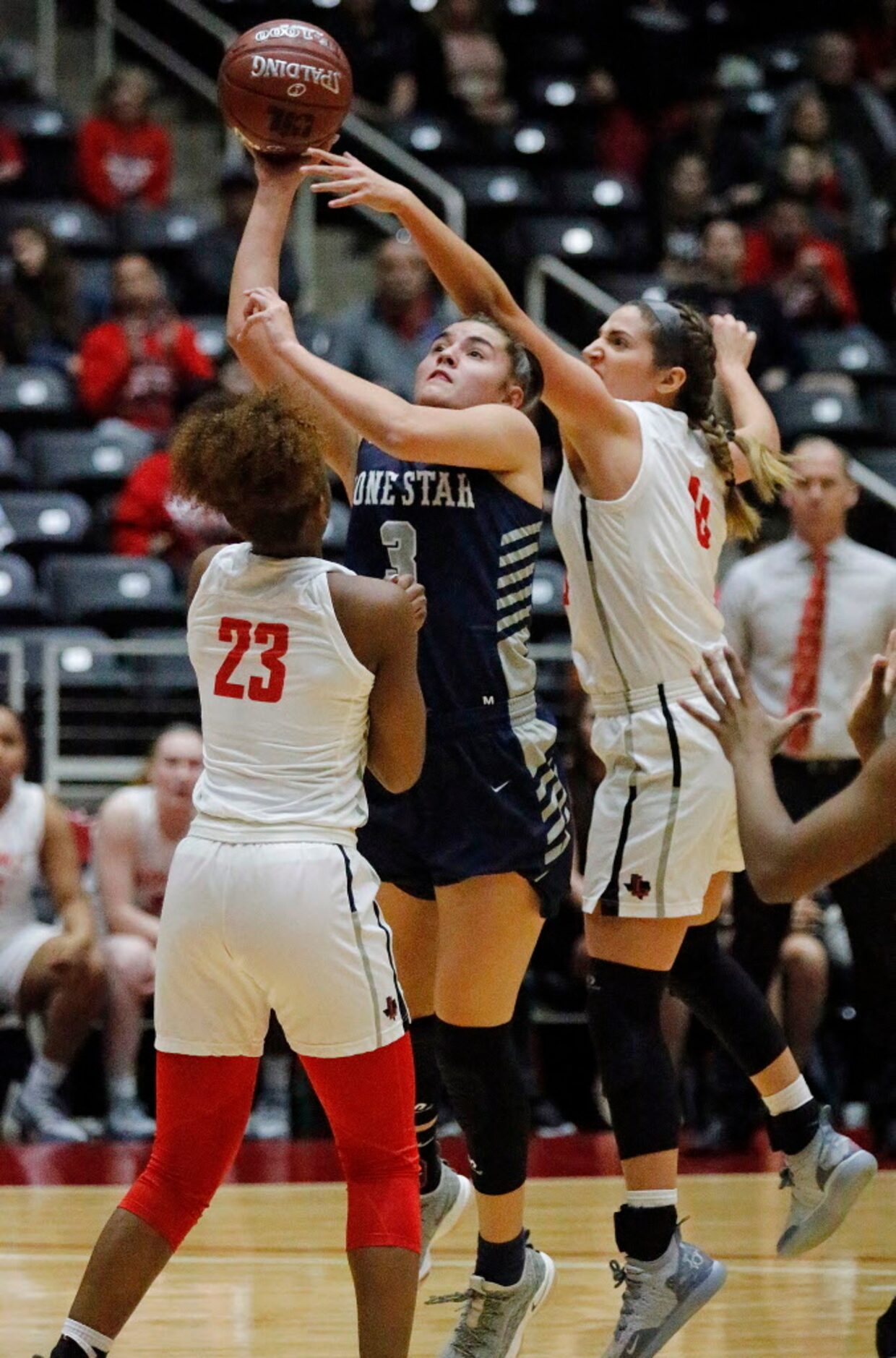 Lone Star High School forward Adryana Quezada (3) gets off a shot and and got the foul call...