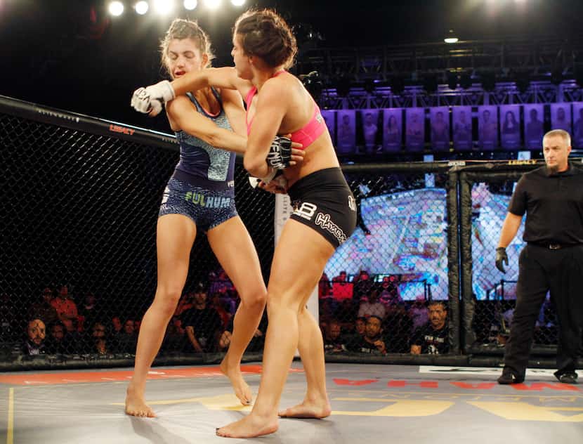MacKenzie Dern, right, lands a right fist on Montana Stewart during their fight at Legacy...