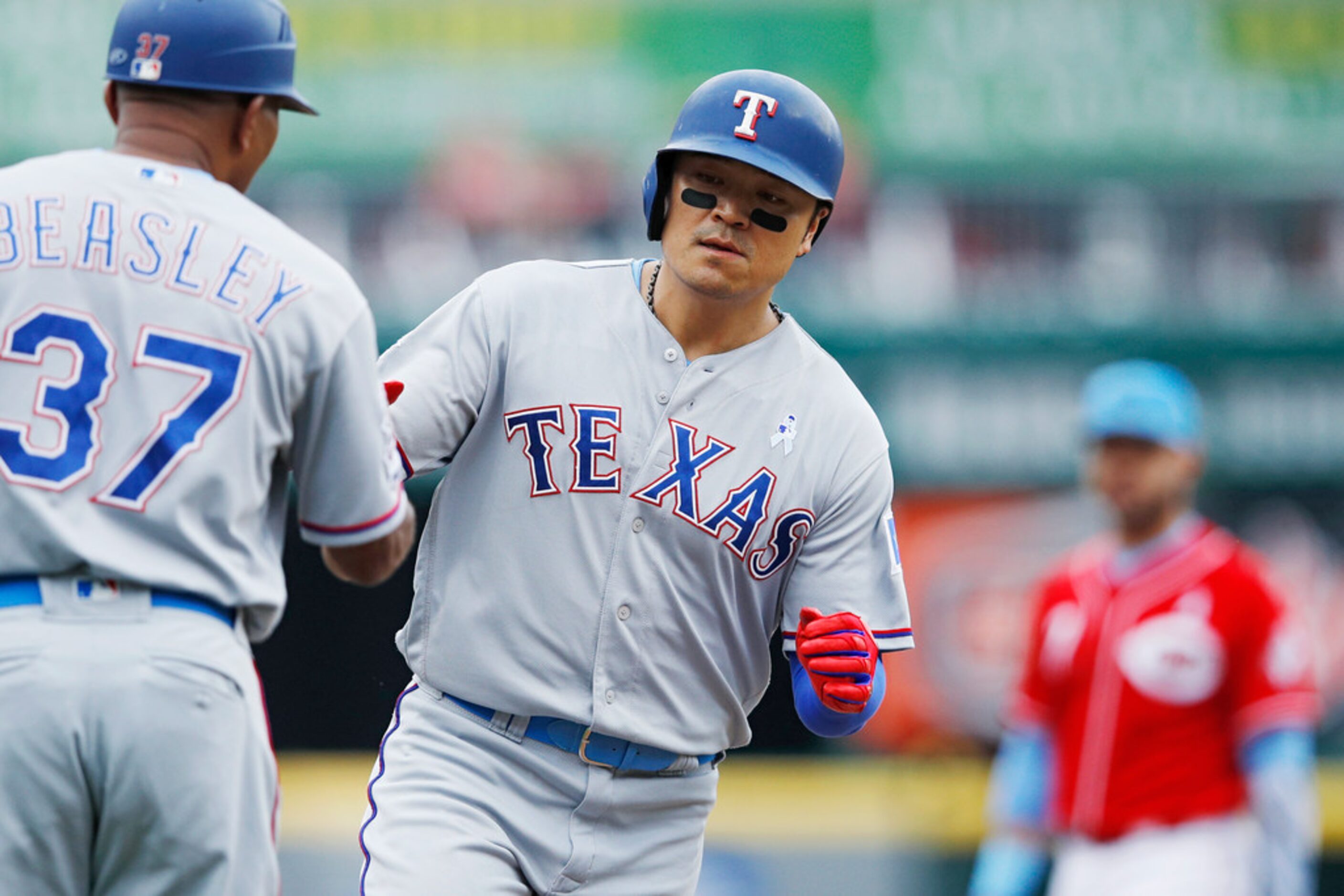 CINCINNATI, OH - JUNE 16: Shin-Soo Choo #17 of the Texas Rangers rounds the bases after a...