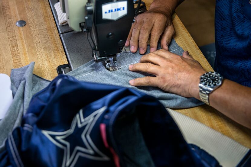 John Seok works on alterations at Preston Royal Cleaners and Lucy's Tailor in Dallas last...