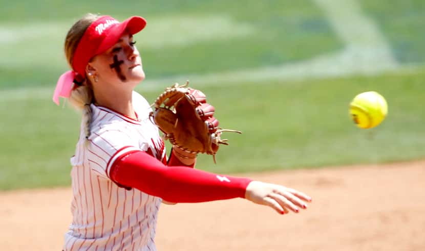 Melissa shortstop Caigan Crabtree (0) throws out a Lake Belton batter after fielding the...