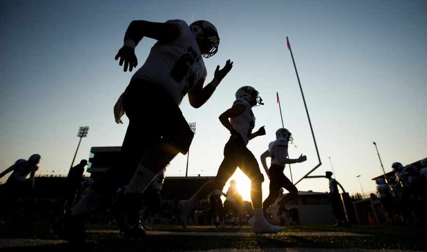 Mesquite Poteet football players warm up before a high school football game between Mesquite...