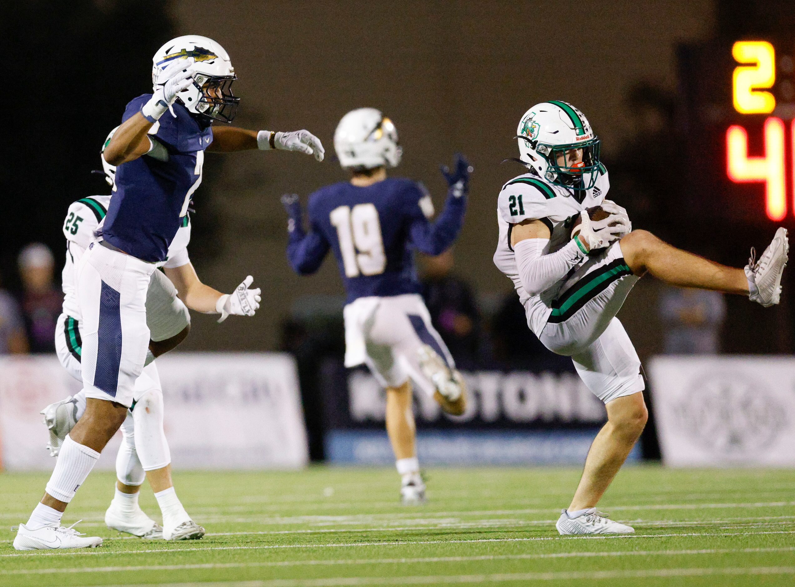 Southlake Carroll defensive back Zack Engelhardt (21) intercepts a pass intended for Keller...