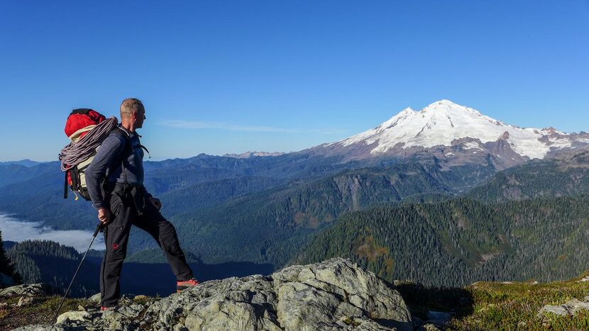 Yager  looks out over the Cascade Range.   Ice climbing is arduous and yields inspiring views.