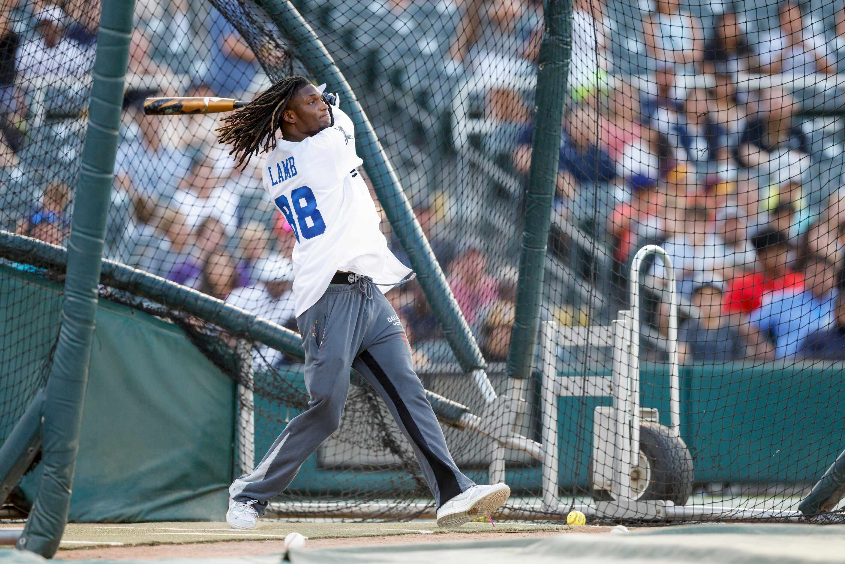 Dallas Cowboys wide receiver CeeDee Lamb swings the bat during the Reliant Energy Home Run...