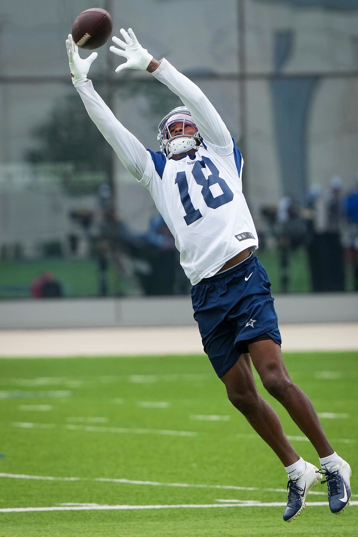 Dallas Cowboys wide receiver Aaron Parker reaches for a pass during a minicamp practice at...