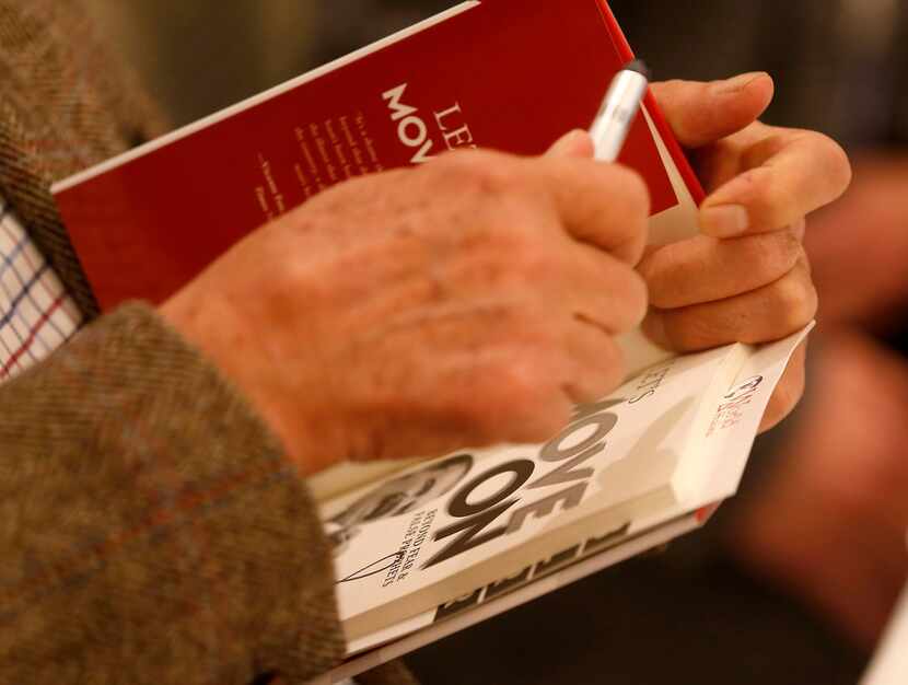 Former Mexican President Vicente Fox signs autographs on his book, Revolution of Hope: The...