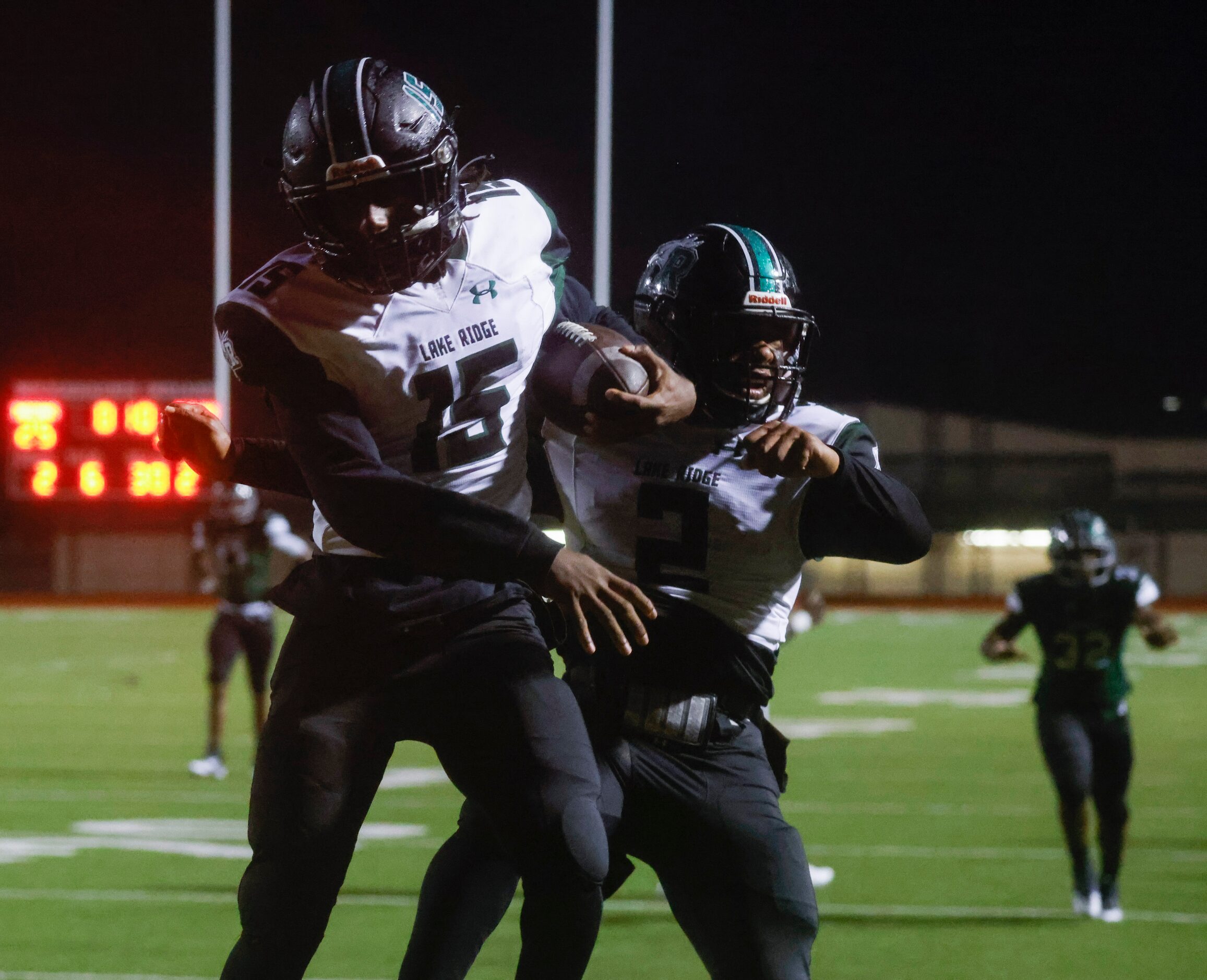 Mansfield Lake Ridge High School’s Zaden Jackson (15) and Tanner Grimes (2) celebrate a...