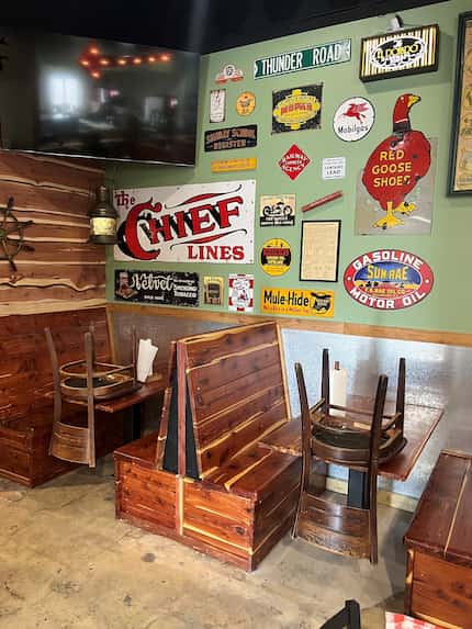 The interior of the new restaurant will have the same nostalgic metal sign decor and...