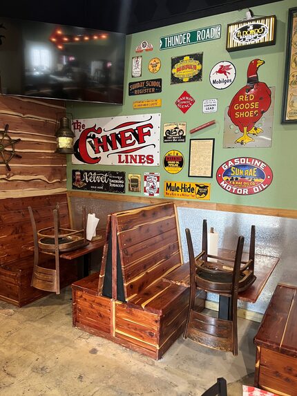 The interior of the new restaurant will have the same nostalgic metal sign decor and...