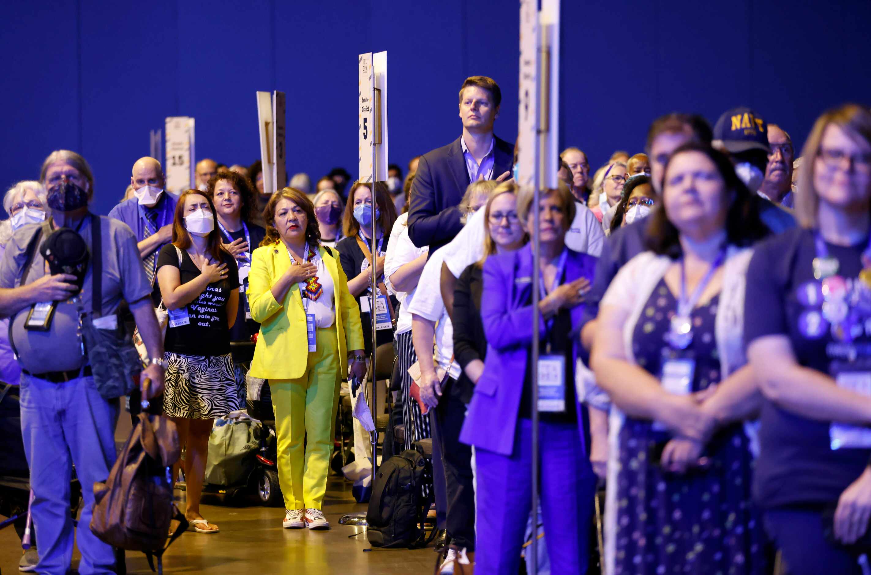 Delegates and guests stand for the national anthem as the 2022 Texas Democratic Convention...