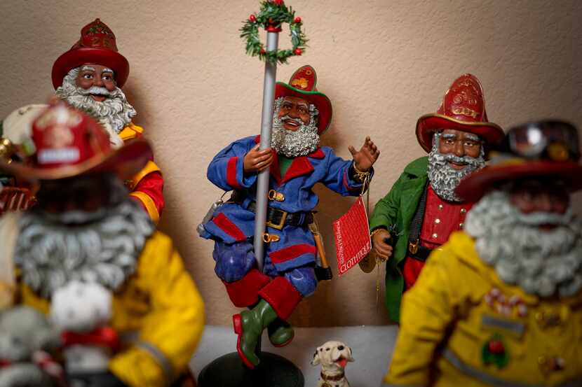 Among the collection are assorted Santas in colored suits.