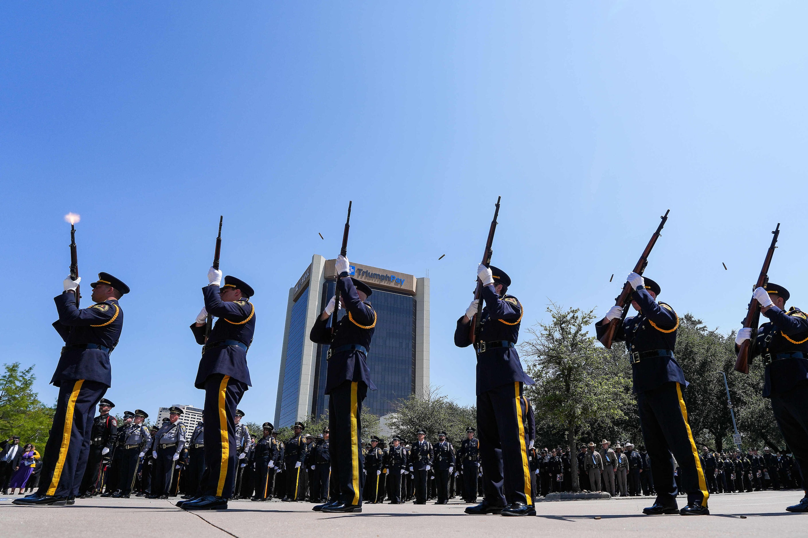 Dallas police honor officer Darron Burks with a 21-gun salute during funeral services at...