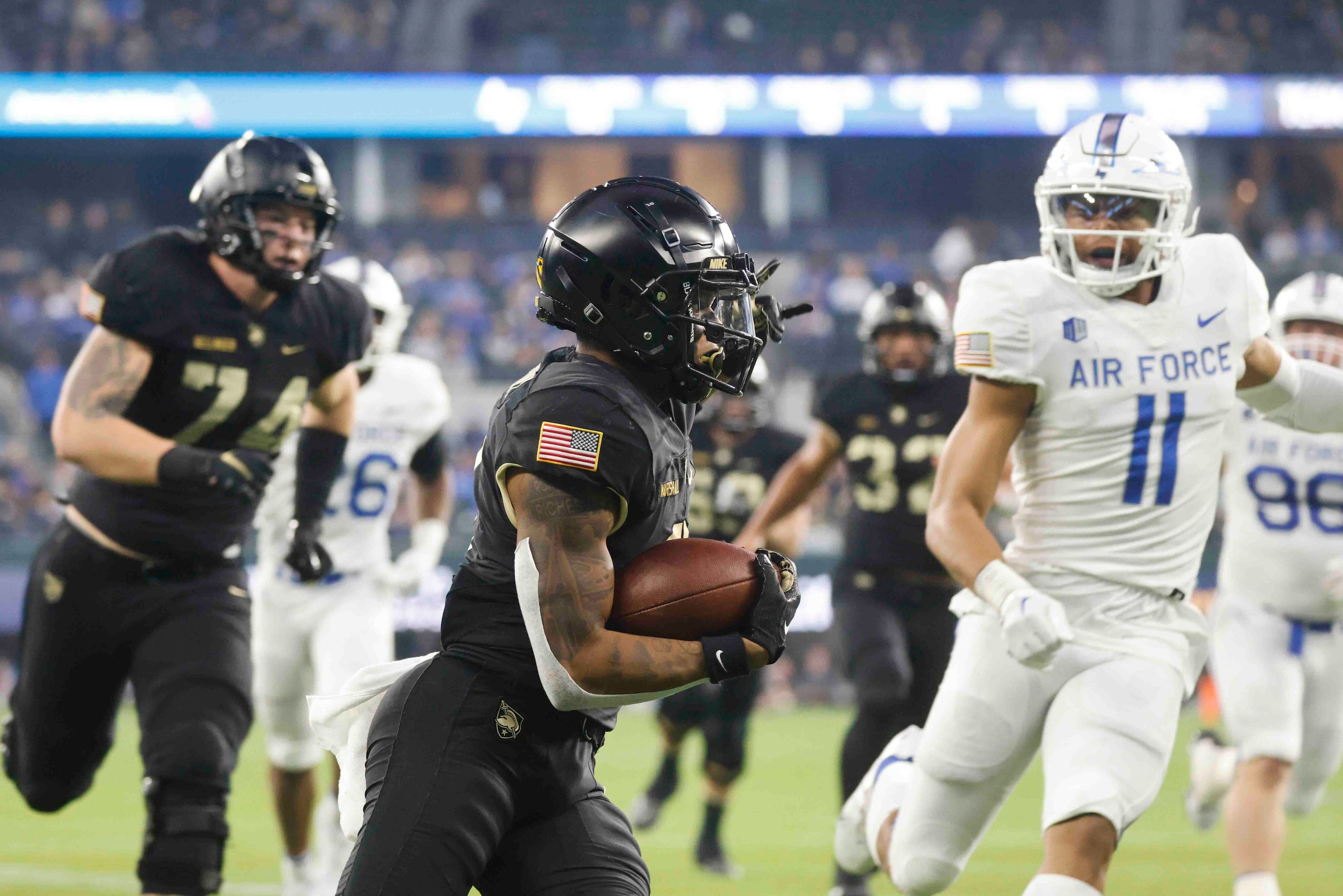 Army running back Ay'Jaun Marshall (3) runs for a yardage against Air Force during the first...