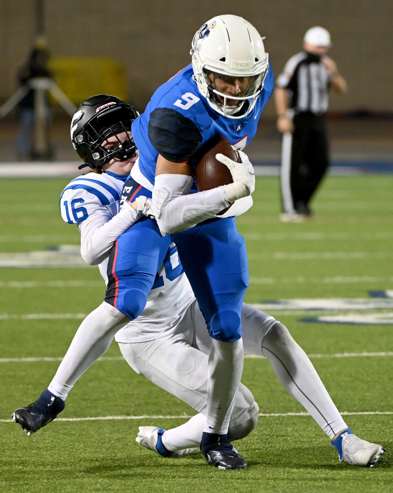 Allen’s Bryson Green (9) tries to run through a tackle attempt by Plano West’s Reese Gunby...