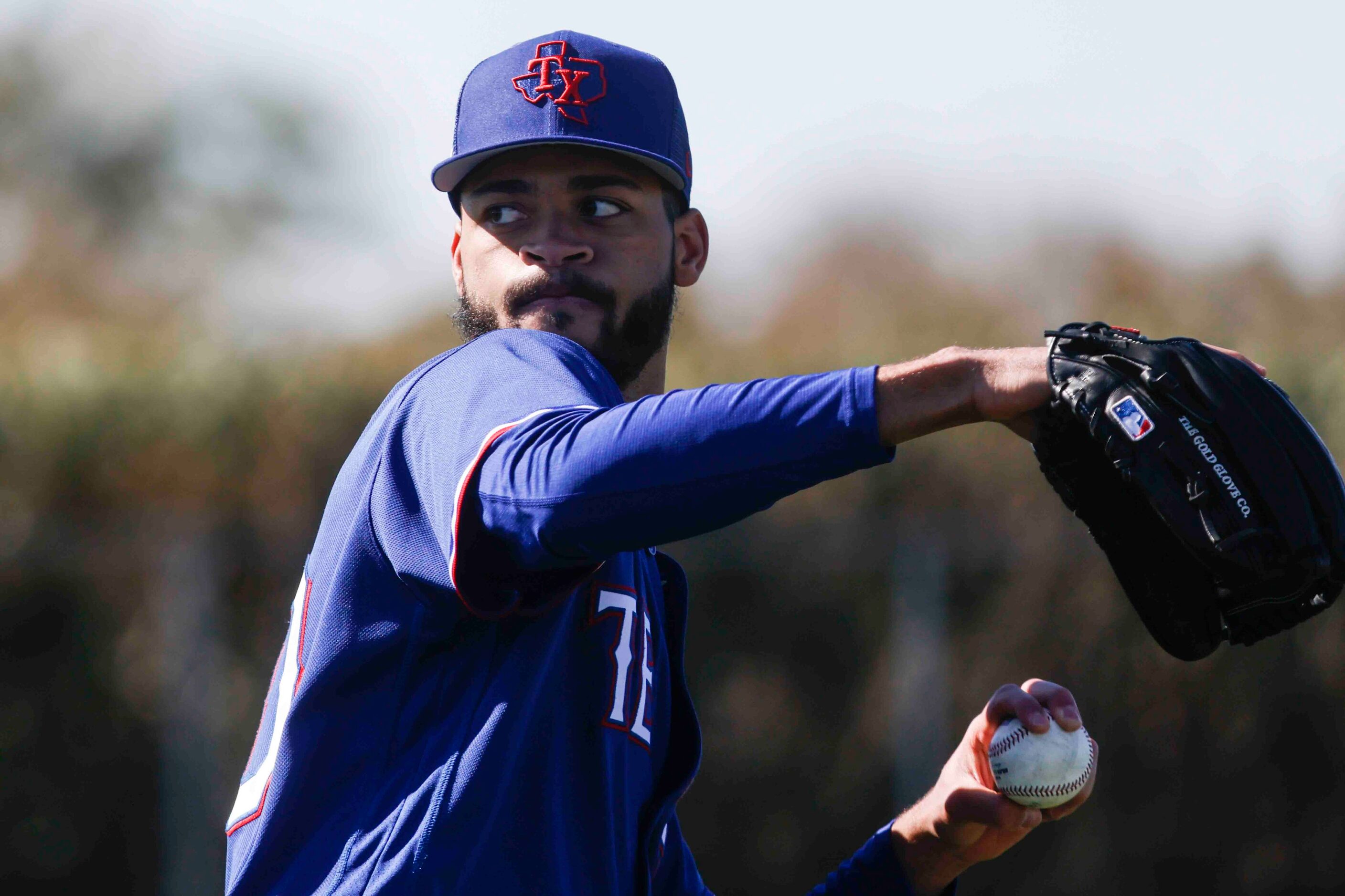 Texas Rangers left handed pitcher Antoine Kelly participates in a drill during the first...