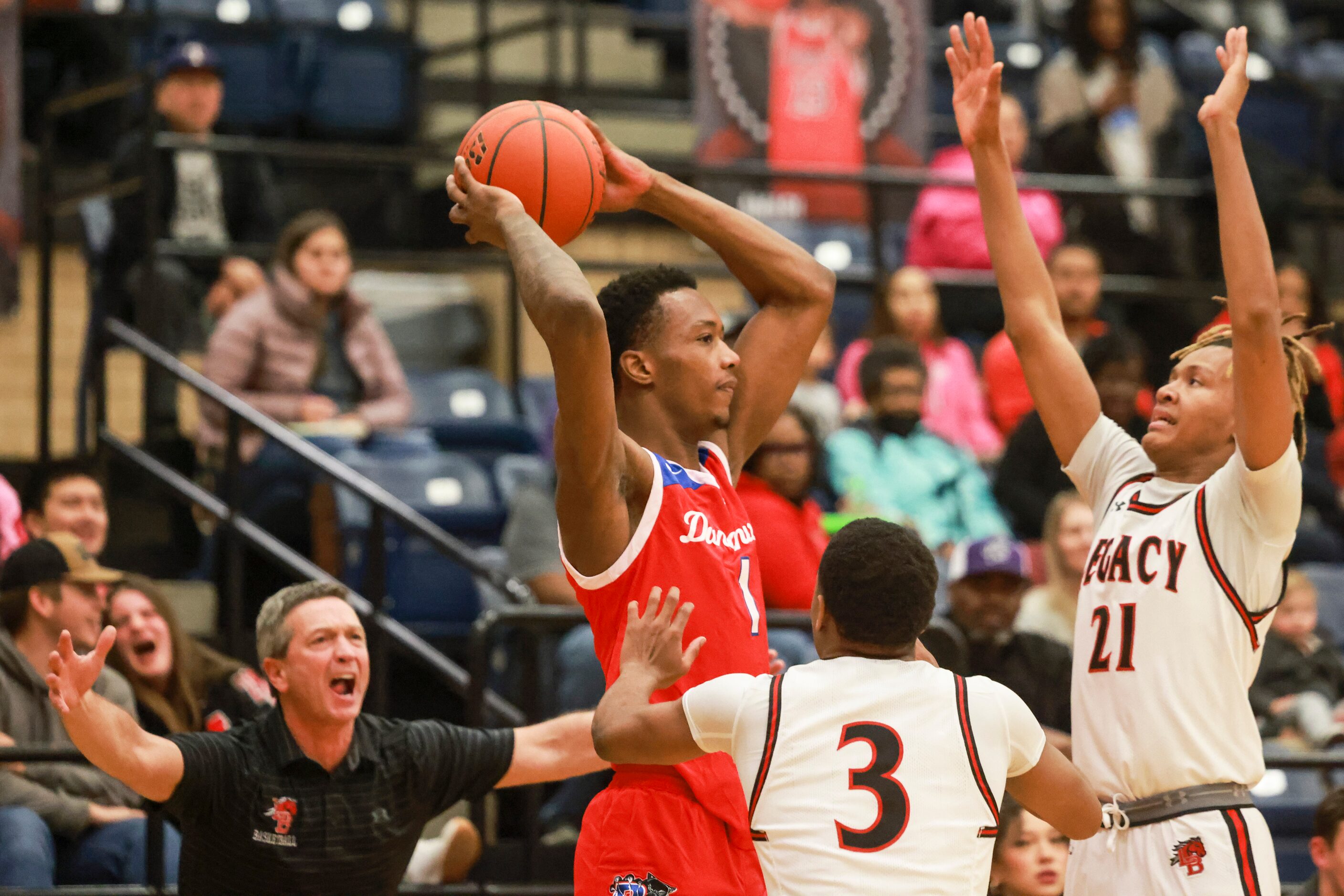 Duncanville High School’s Ron Holland (1) is defended by Mansfield Legacy High School’s...