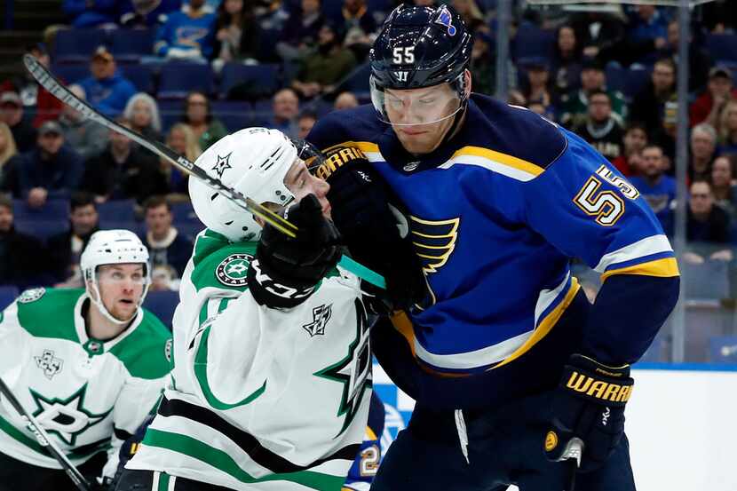 Dallas Stars' Tyler Pitlick collides with St. Louis Blues' Colton Parayko (55) during the...