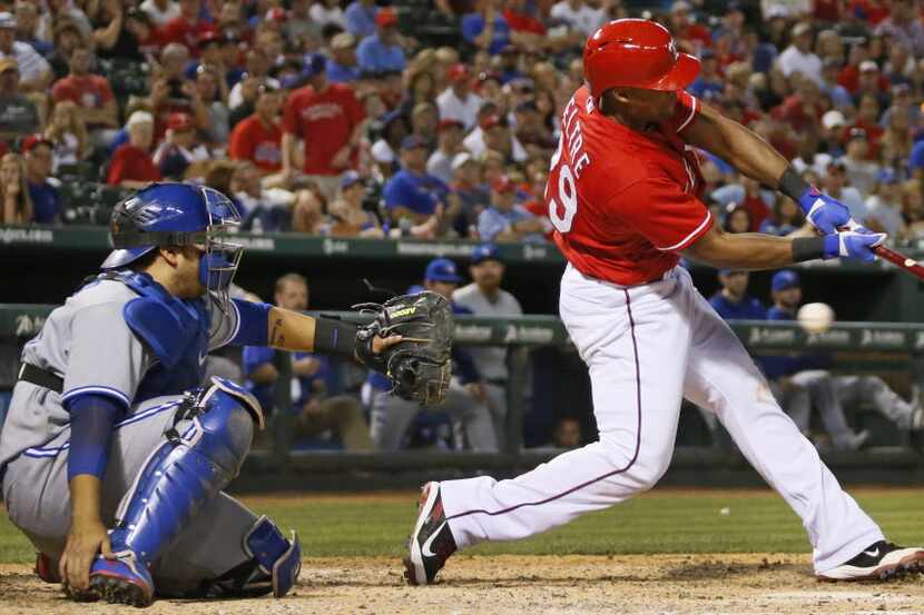 Texas third baseman Adrian Beltre strikes out swinging to end the eighth inning during  the...