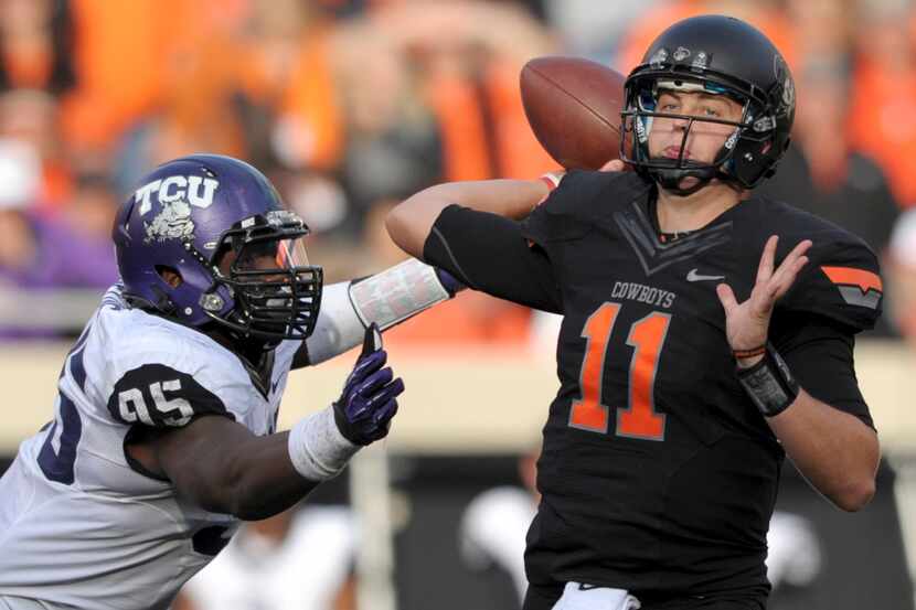 In this Oct. 27, 2012, file photo, TCU defensive end Devonte Fields, left, pressures...