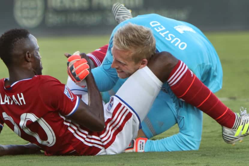 Vancouver Whitecaps FC goalie David Ousted (1) flashes a smile as he helps FC Dallas' Roland...