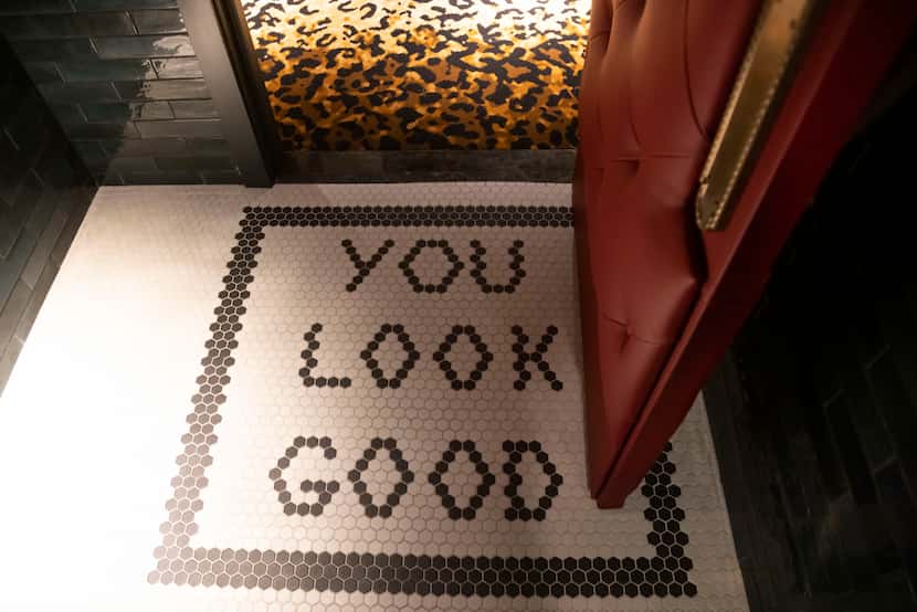 “YOU LOOK GOOD” written in tile in the restroom at Babou’s inside of Hôtel Swexan in the...