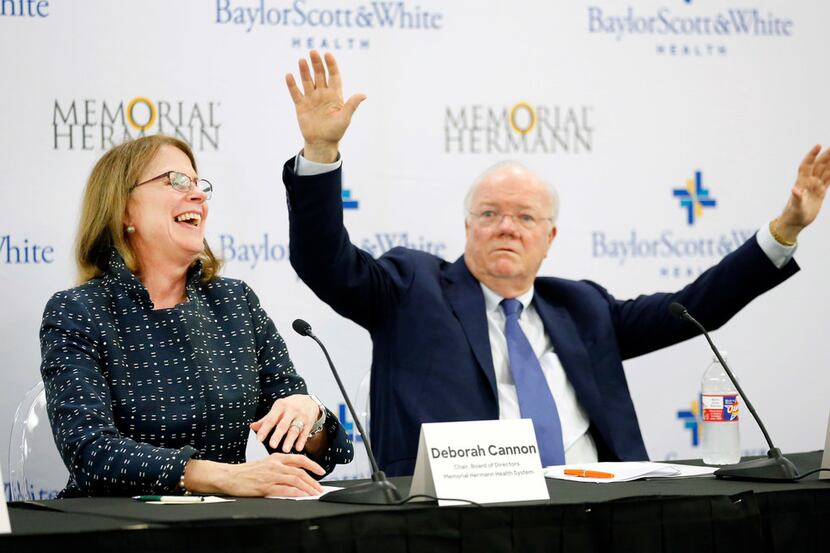 Deborah Cannon, chair of Memorial Hermann's board, laughs at Ross McKnight, chair of Baylor...