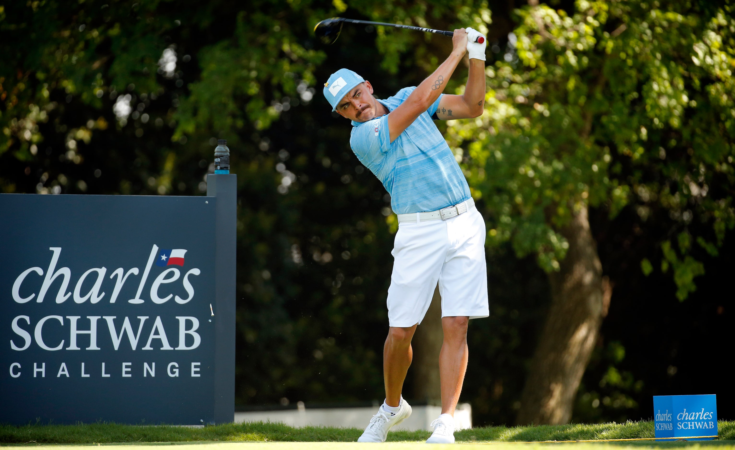 PGA golfer Rickie Fowler tees off on No. 9 during the Charles Schwab Challenge practice...