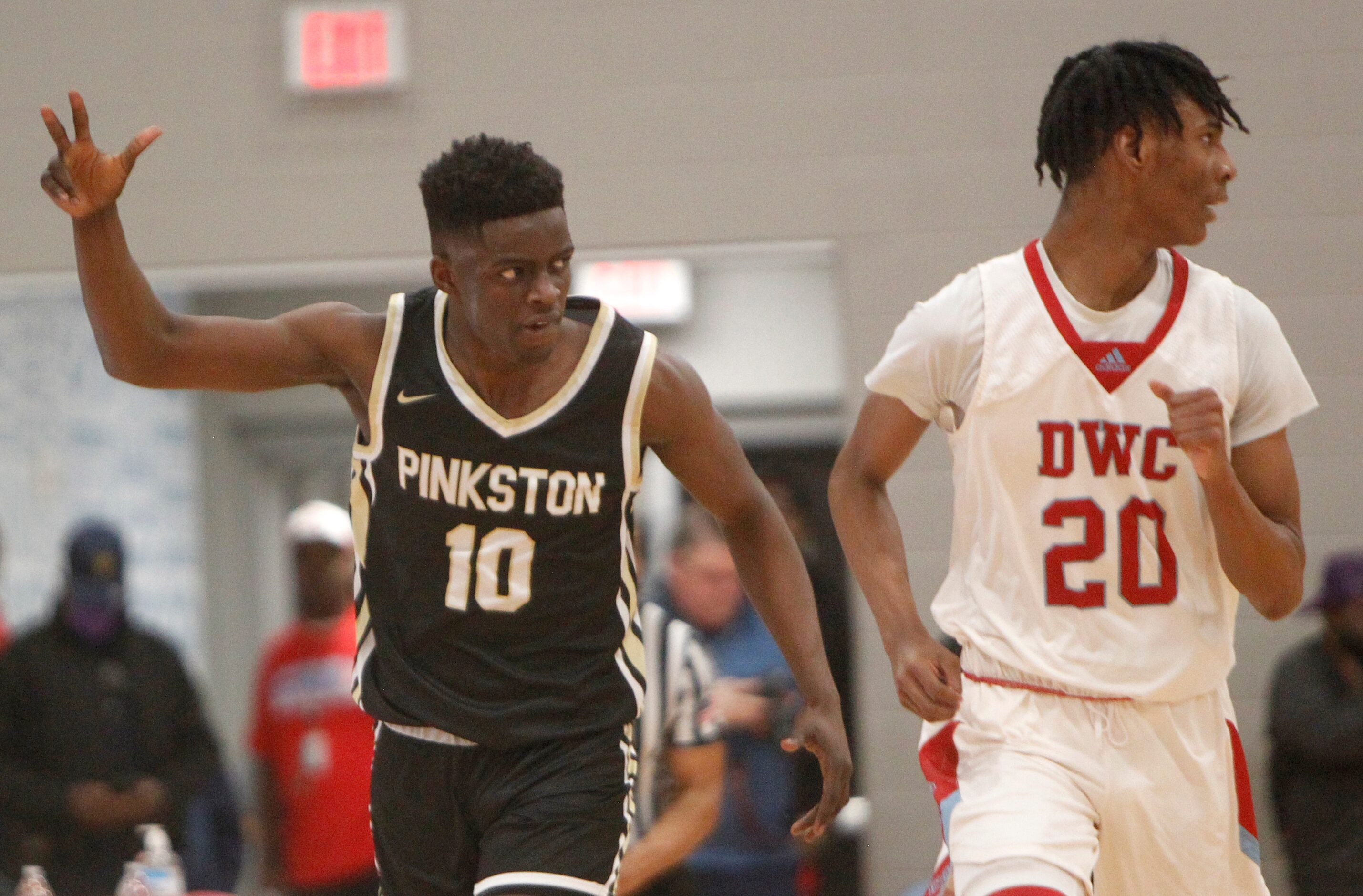 Dallas Pinkston's Rashad Simpson (10) reacts after sinking a 3-pointer as Dallas Carter's...