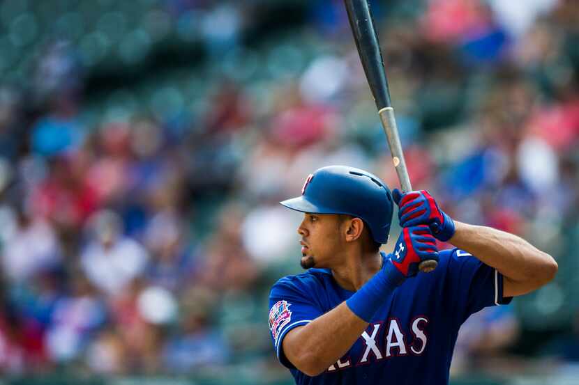 Texas Rangers first baseman Ronald Guzman (11) bats during the eighth inning of an MLB game...
