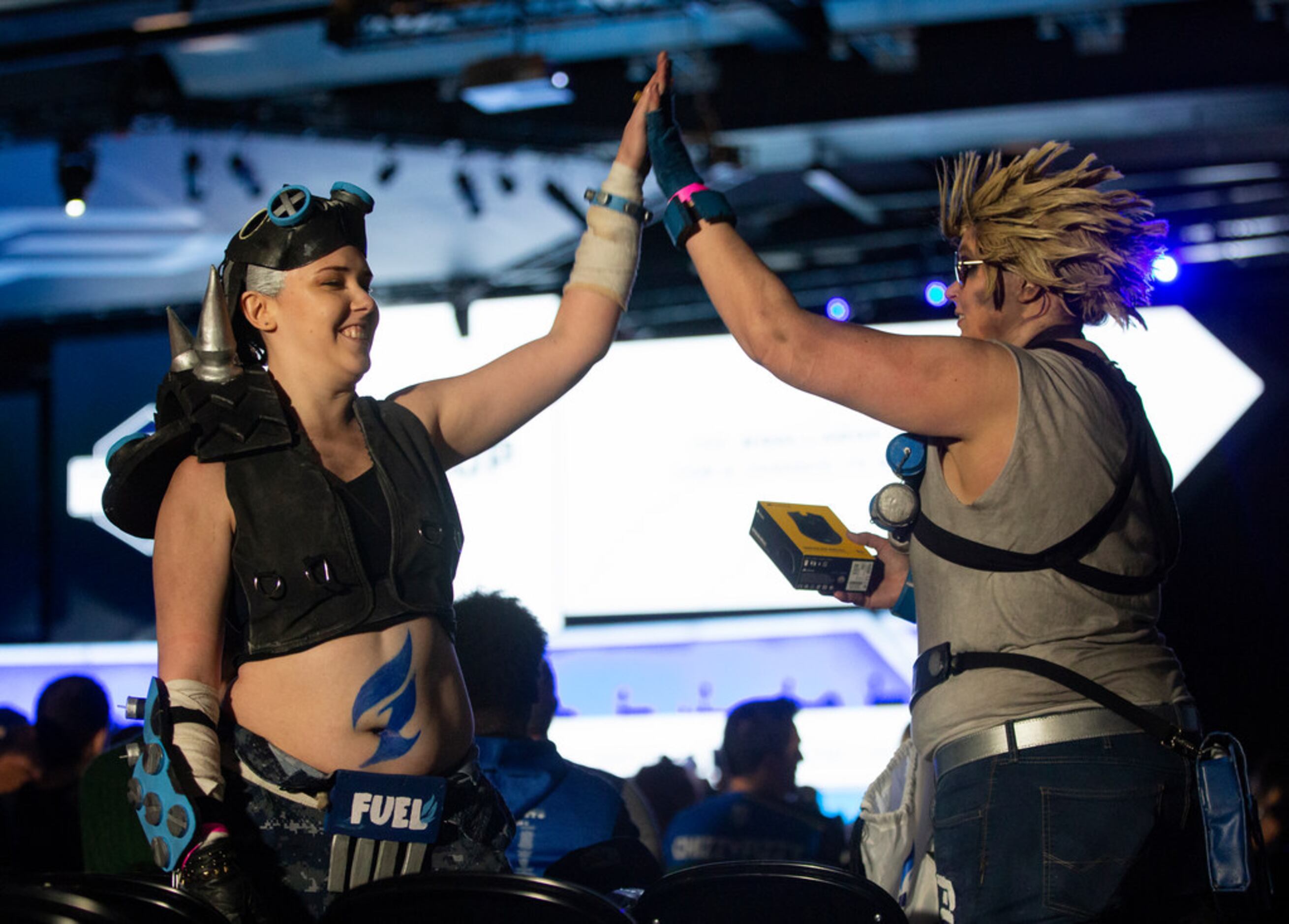 Sisters Kas and Kat Bradley from Dallas wear costumes inspired by the The Dallas Fuel during...