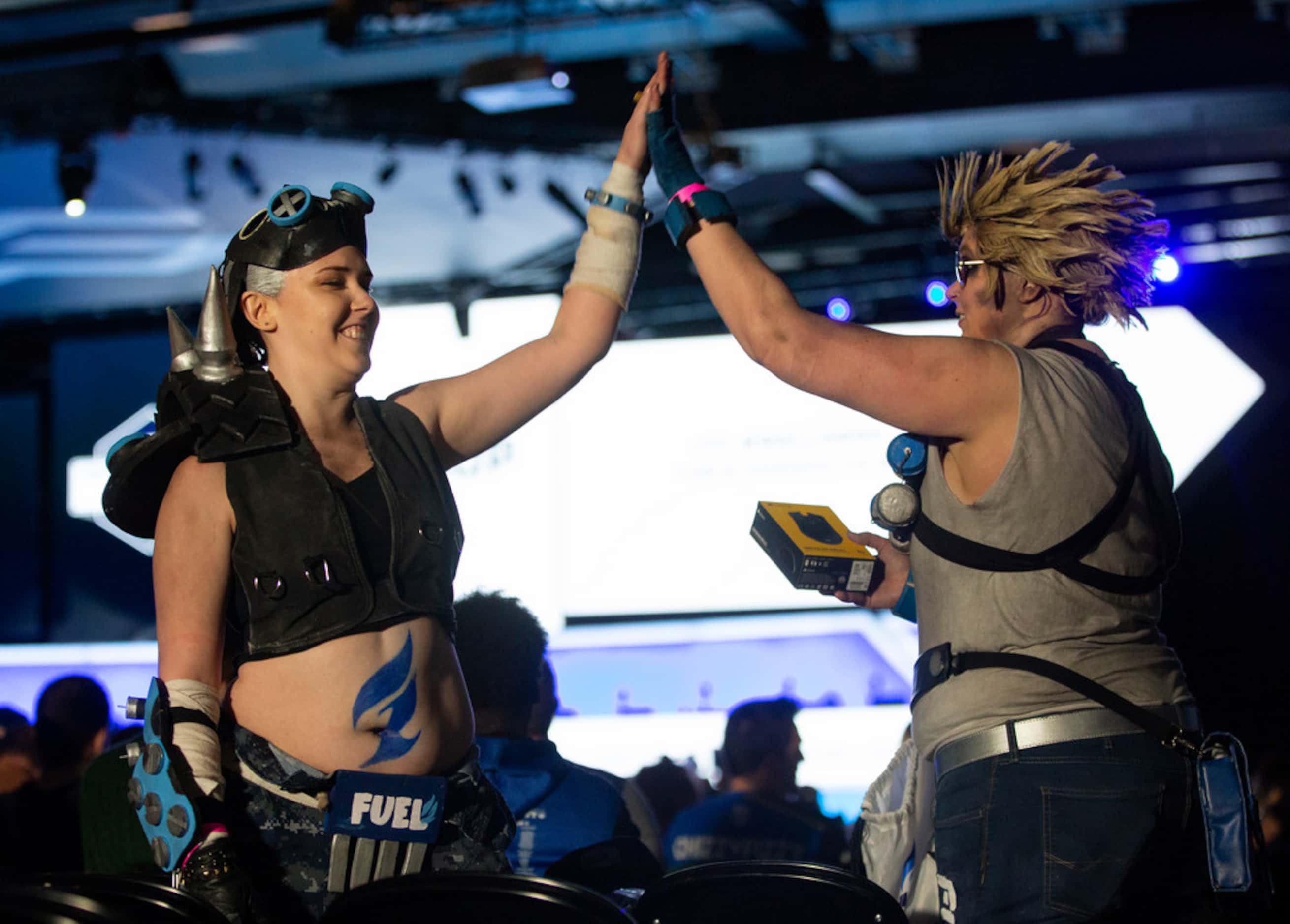 Sisters Kas and Kat Bradley from Dallas wear costumes inspired by the The Dallas Fuel during...