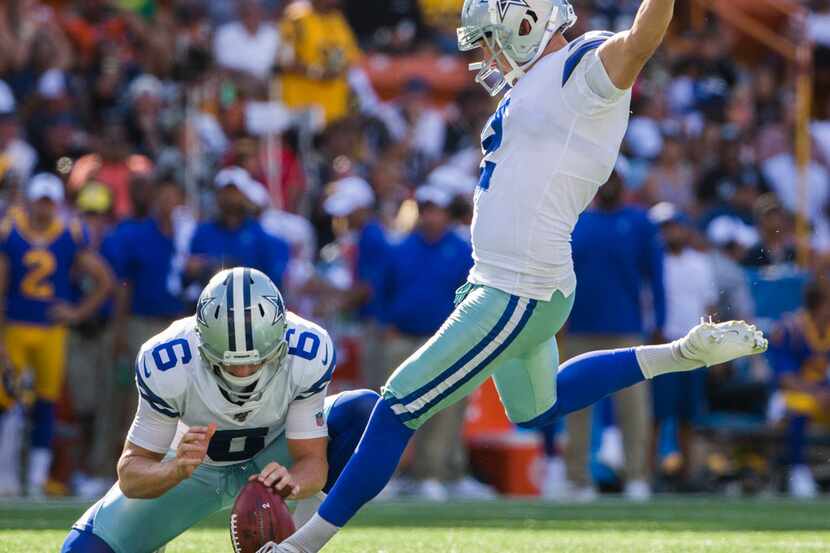 Dallas Cowboys kicker Brett Maher (2) kicks an extra point after a touchdown during the...