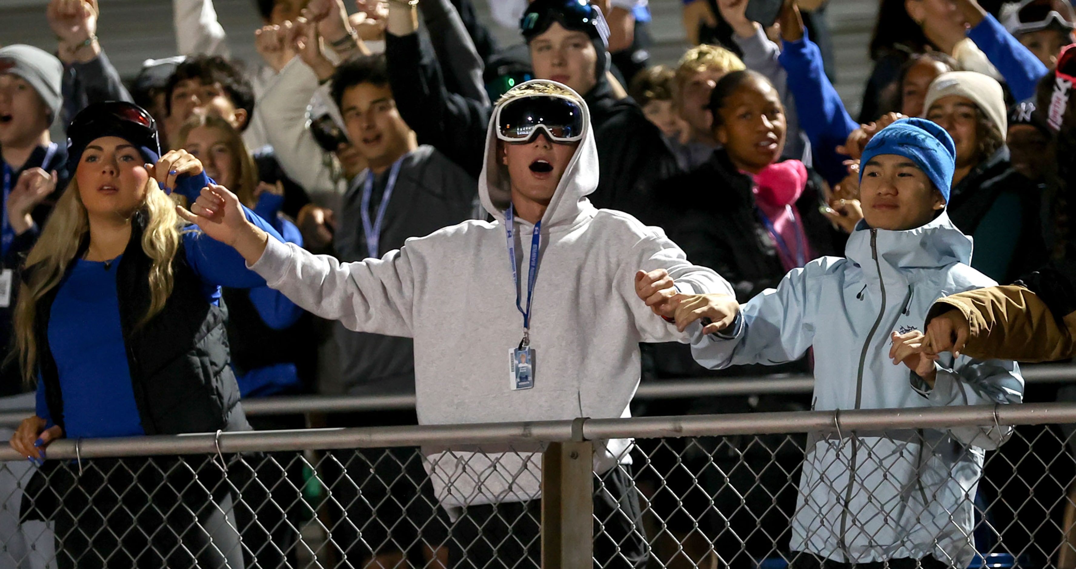 The Hebron students cheer on their Hawks against Flower Mound during the first half of a...