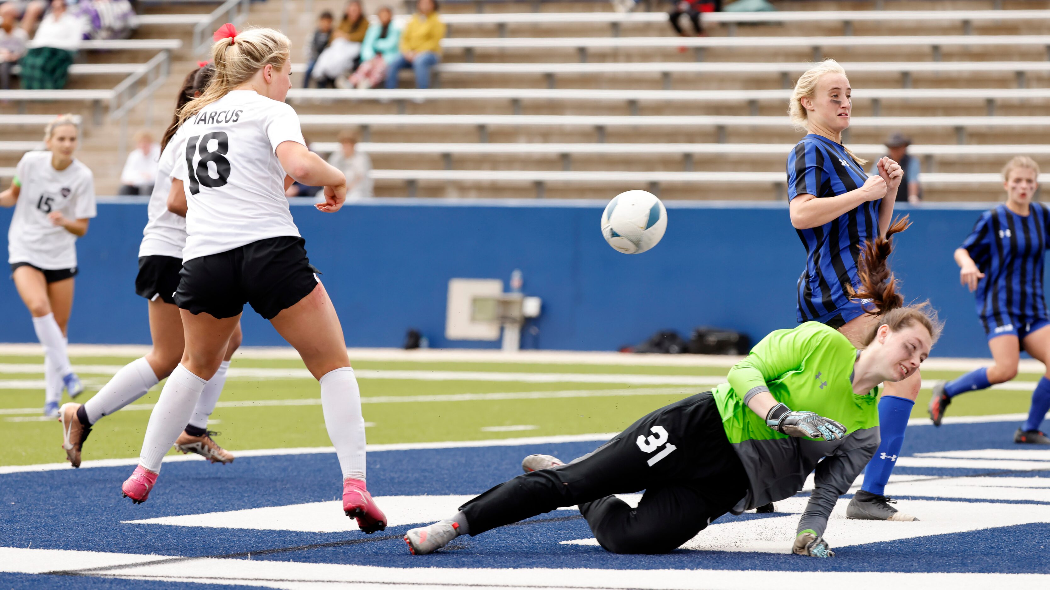 Trophy Club Byron Nelson goalie Raelyn Stone (31) takes a shot to her body by Flower Mound...