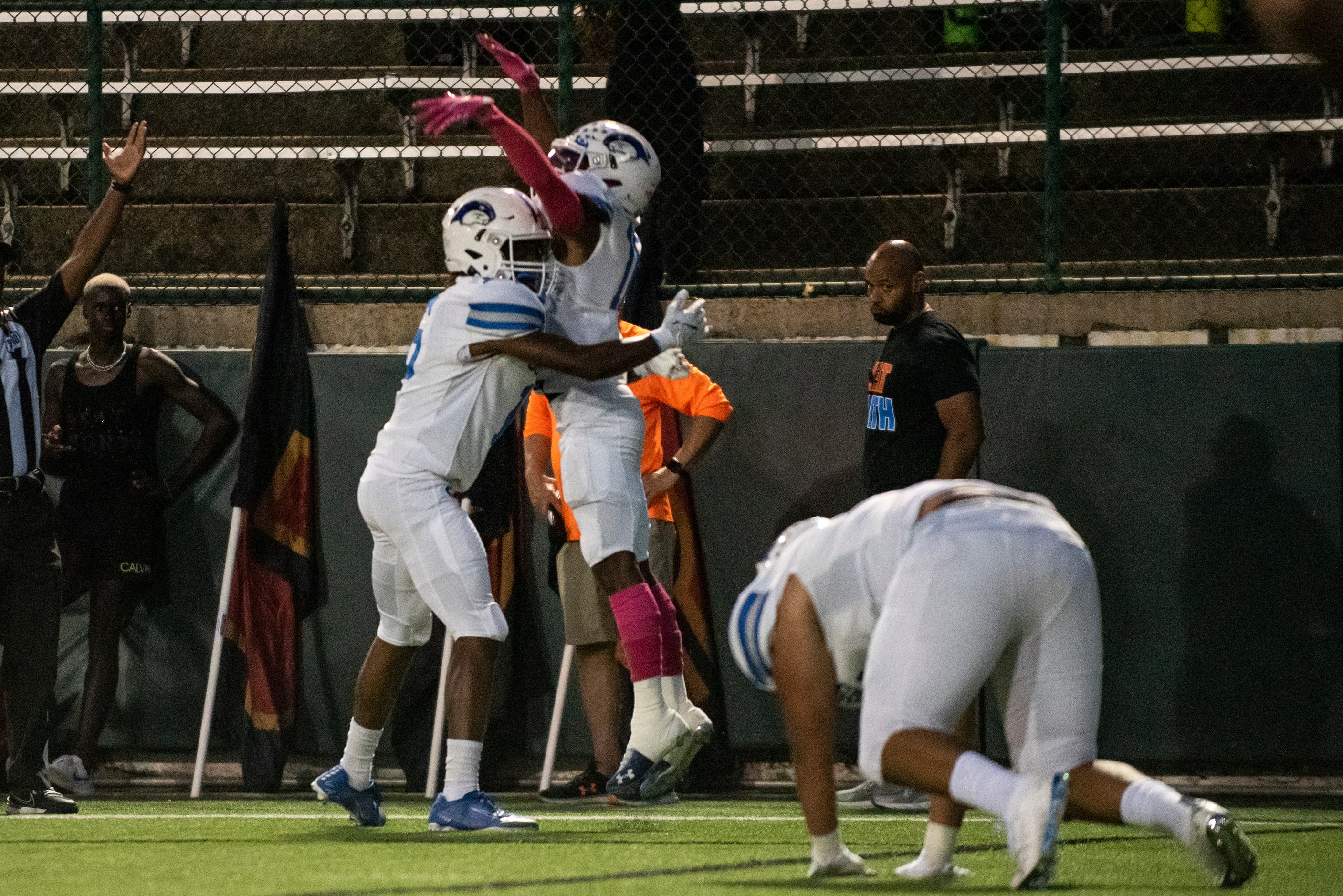 Grand Prairie sophomore Kelton Moore (16) hugs Grand Prairie senior Drew Damper (10) after...