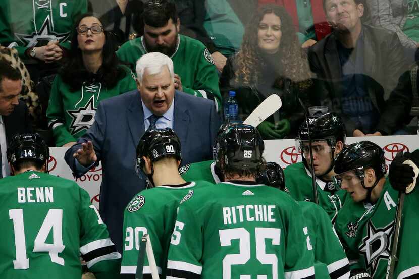 Dallas Stars head coach Ken Hitchcock speaks to his team late in the third period of a...