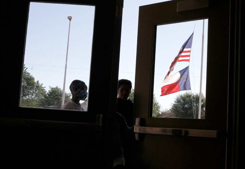 Students enter George W. Carver Creative Arts Learning Center on May 25, 2017. The school...