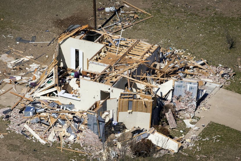 An aerial photograph taken Friday, February 26, 2016 shows remnants of tornado damage to a...