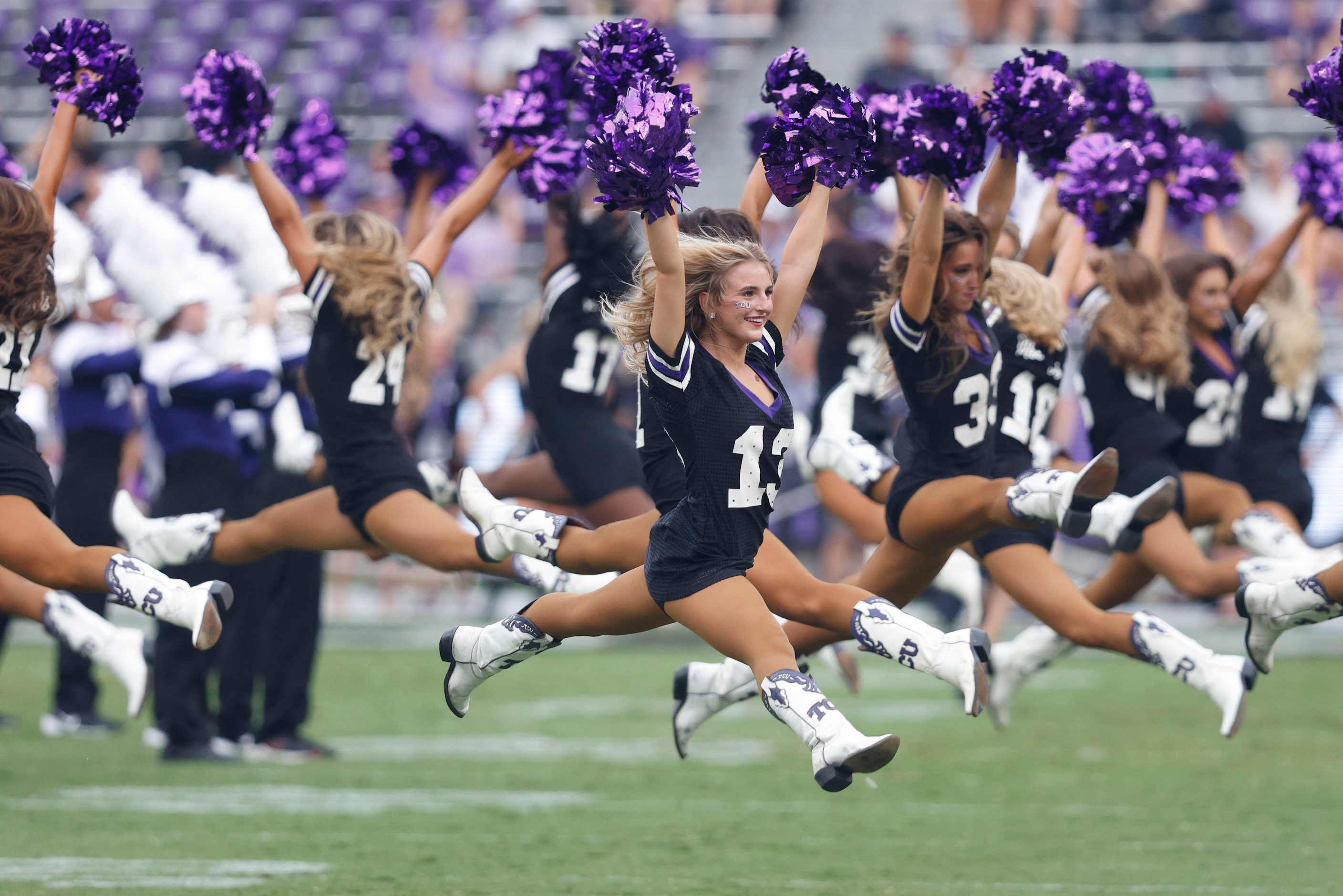 TCU Showgirls members perform before an NCAA college football game against the UCF at TCU,...